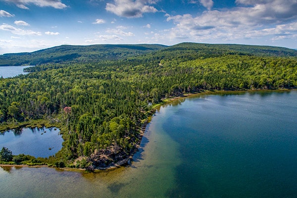 Areal View of Bras d´Or Boating Estates, blue sky and tropical watercolours on Cape Breton Island